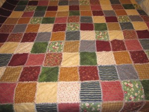 A full size rag quilt for our queen bed